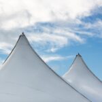row-white-tent-tops-blue-sky_181624-61280
